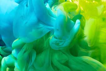 Abstract blue, green and yellow ink in water