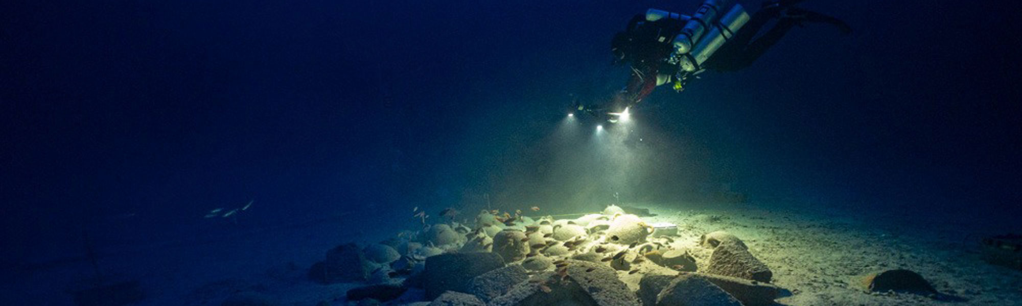 Diver exploring archaeological remains under-water