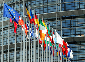 Flags with European Parliament in background Strasbourg, France.