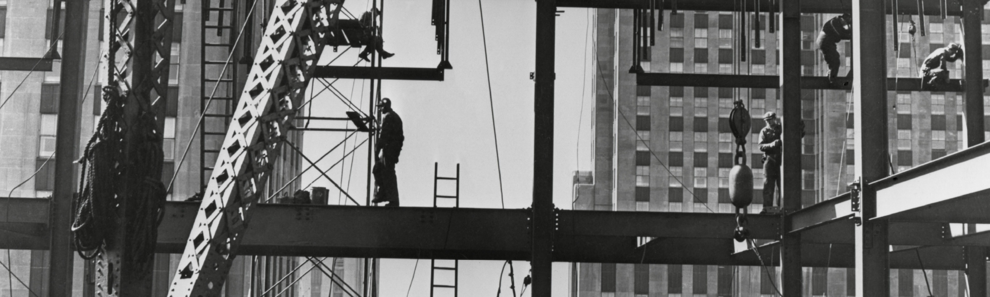 An old image of a skyscraper being constructed