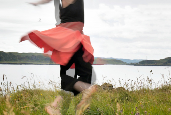 A photo of a dancer in a field