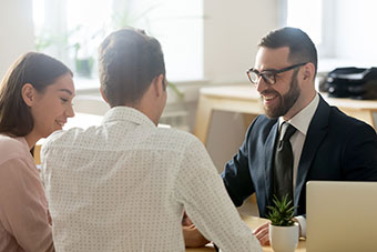 Three persons discussing a point