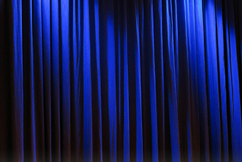 A blue stage curtain